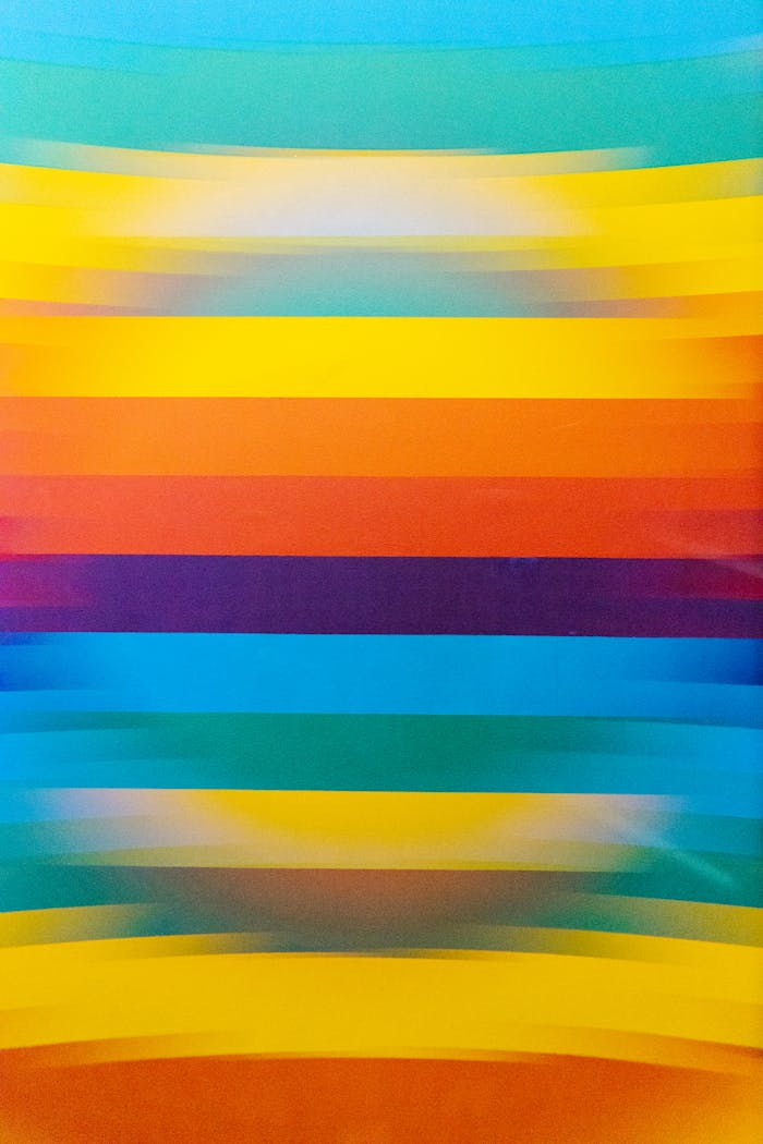 A vibrant abstract design with blurred colorful horizontal stripes, creating a dazzling visual pattern.